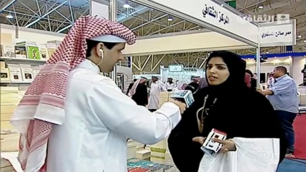 In this frame grab from Saudi state television footage, doctoral student and women's rights advocate Salma al-Shehab speaks to a journalist at the Riyadh International Book Fair in Riyadh, Saudi Arabia, in March 2014. A Saudi court has sentenced al-S