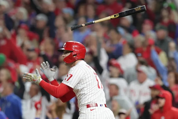 Rhys Hoskins tosses aside his bat after hitting a two-run home run in the fifth inning, his second homer of the night.